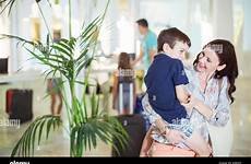 son mother hotel carrying lobby alamy