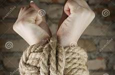 hands tied rope stock