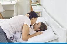 daughter bed kiss mother lying happy morning hugs girl gives while stock dreamstime