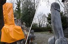 penis statue giant condom covered bright controversial express yellow holy solved problem