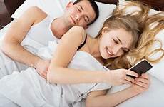 cheating texting spouse laying