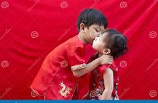chinese boy girl traditional china tang greeting suit red stock