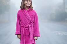 barefoot girl wet bathrobe pink street portland oregon foggy stocksy carleton photography stands morning