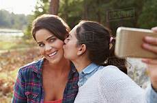 lesbian couple kiss selfie countryside take stock dissolve d430
