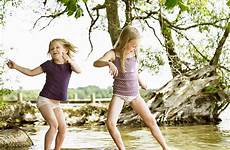 playing girls lake river dance stock smiling videos