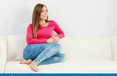 sofa girl barefooted couch woman sitting preview