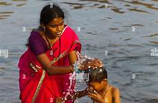bathing indian river son mother his alamy india tungabhadra waters stock hampi
