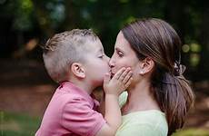 boy kiss young mother son mouth cute his giving