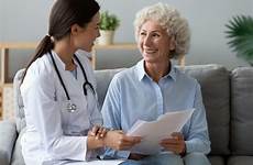 doctor patient woman old happy papers patients young
