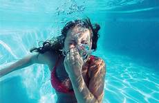 breathing underwater breath woman holding her bikini stocksy trick lund jacob perfect