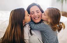 kissing mom daughters her family