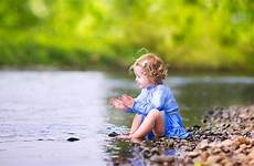 river water girl playing