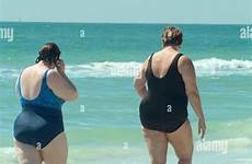 beach women overweight walking fat along two stock alamy