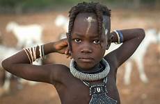 hair himba girl tribe her mud little young braided shows braids off namibia look double heavy tribeswomen