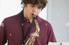 boy saxophone playing stock teenaged alamy sax