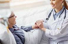 patient smiling doctor hand keeping women