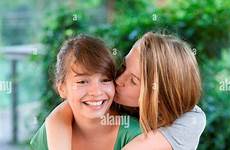 girls teenage kissing old year 13 teen two alamy girl stock cheek