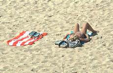 sunbathing beach bondi woman
