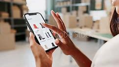 Hand, cellphone screen and online shopping for fashion purchase or shoes, digital app or product. Woman, scroll and shipping courier or virtual stylist in factory with boxes, supply chain or retail