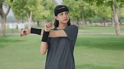 Indian girl doing arm exercise