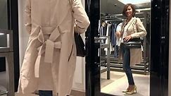 Asian people shopping for fashion goods and accessories. Confident Japanese woman smiling in luxury shop inside mall. Happy lady buying new leather bag in store and looking at mirror in Tokyo