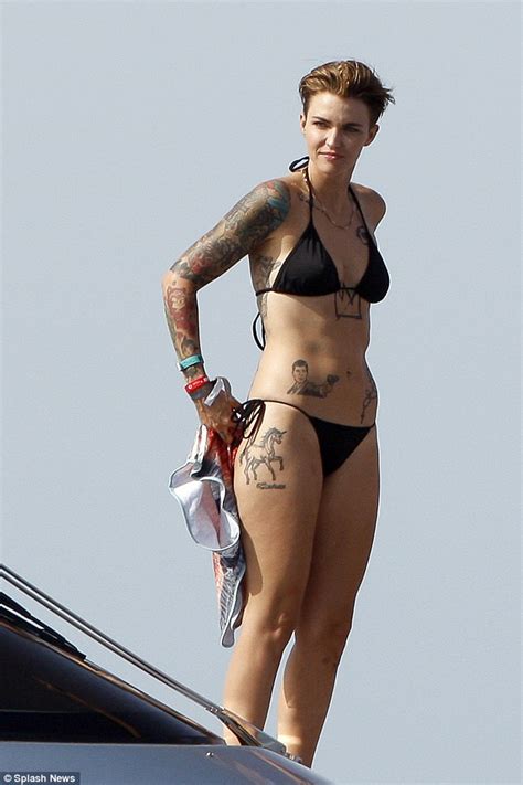 More ideas from black rose tattoo shop. Ruby Rose shows off her tattoos in black bikini in Ibiza ...