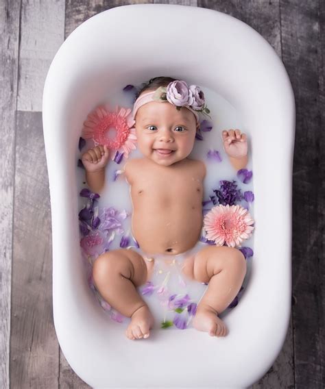 I got fed up of bathing her sister in the big bath then trying to sort ella in the baby bath. #newborn | Baby milk bath, Spring baby pictures, Baby ...