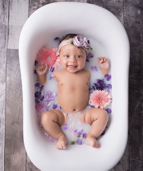 When you are ready to start transitioning your baby into the real bathtub (typically. #newborn | Spring baby pictures, Baby milk bath, Baby ...