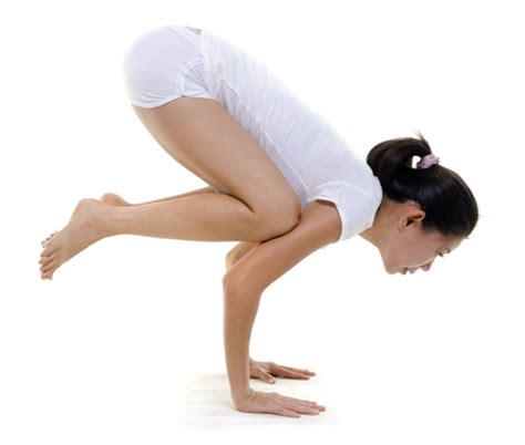 Man performing an eka pada bakasana yoga pose. Bakasana (Crow Pose) - How to do and its Benefits