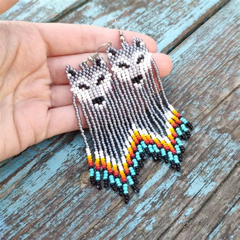 Collective care is collective healing. Wolf seed bead earrings Native beaded earrings Grey fringe ...