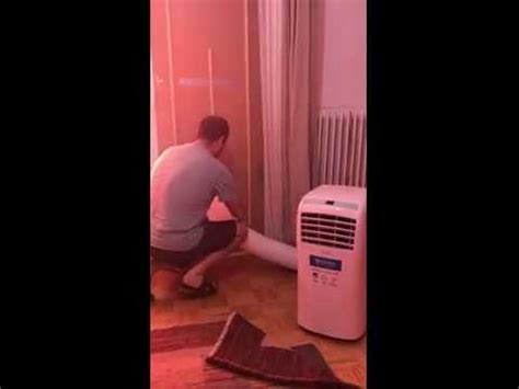Most people solve this issue by just running the vent hose out a window. Portable air conditioner exhaust vent through the door way ...
