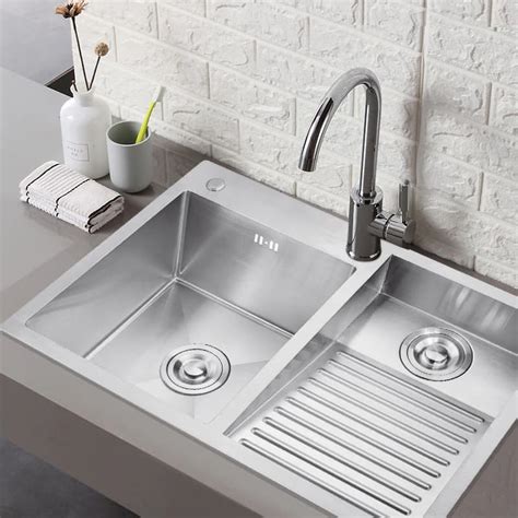 The sizes of laundry sinks are typically from 10 inches to 25 inches deep, which is deeper than bathroom and kitchen sinks in order to holding more clothes. What to Consider When Buying a Laundry Sink - LovingLocal