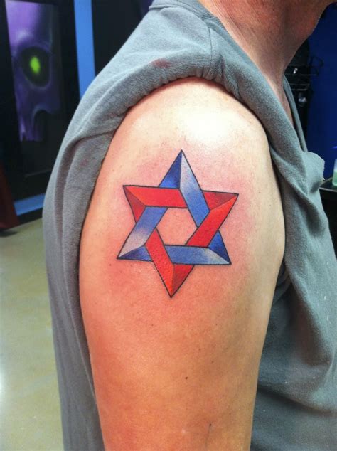 Cross star of david tattoo. Derek Raulerson