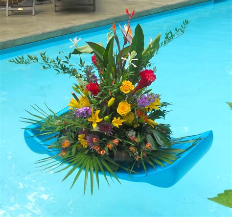 Tropical floral arrangements, heart shaped floral wreaths, and floating candles or lanterns are all popular choices that can add something. Flower float for a pool party | Pool, Celebrity weddings ...