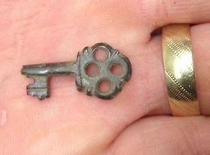 An attached luggage tag with email and phone number is good. Beautiful Tiny Medieval bronze key. metal detecting find ...