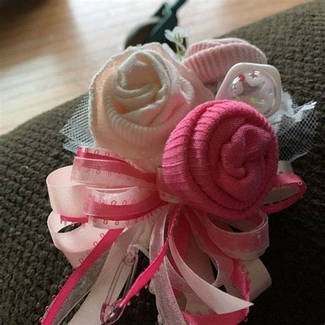 Matches any under the sea, whale, beach or nautical baby shower theme. Baby Sock corsage Handmade baby sock shower corsage Baby ...