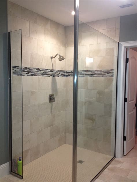 Modern bathroom features a black framed shower enclosure filled with marble tiles fitted with a tiled shower niche as well as a polished. Pool bathroom shower (With images) | Pool bathroom ...