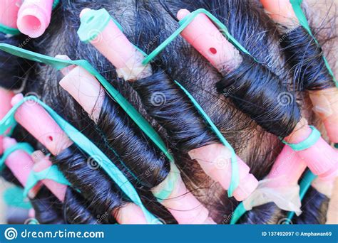 A short hairstyle gives you endless. Top View Head Of Asian Woman Curling And Colorful Rollers ...