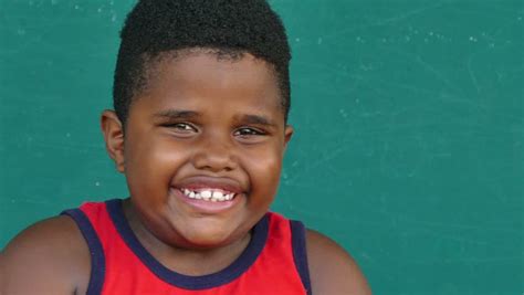 Select from premium fat black boys of the highest quality. Black Or Hispanic Young Boy Smiling, Looking At Camera ...