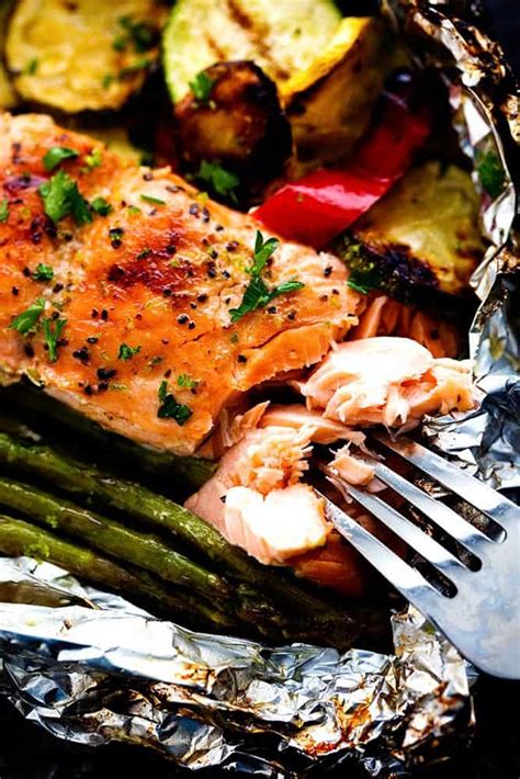 Rub the salmon with oil, salt, and pepper: Grilled Lime Butter Salmon in Foil with Summer Veggies | The Recipe Critic