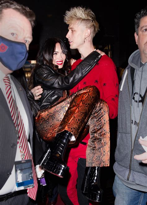 The couple celebrated a milestone accomplishment for mgk at the 2021 billboard music awards, where he. Machine Gun Kelly carries girlfriend Megan Fox through a ...