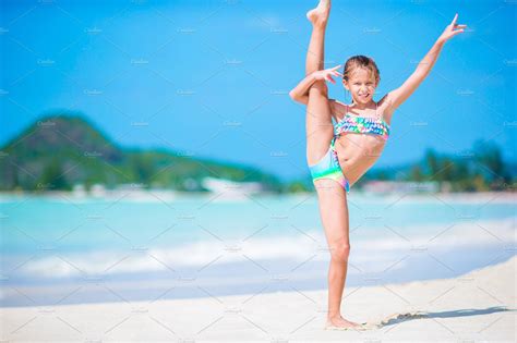 Dreamstime is the world`s largest stock photography community. Beautiful little girl on beach having fun. Happy girl ...