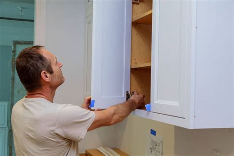 Two screws, located at the top and bottom of the hinge, mount the hinge to the cabinet. How to Adjust Old Cabinet Door Hinges | Homely Ville