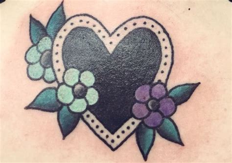 Tattooed in an arrow heart. Pin by Anita Hardy on Tattoos | Black heart tattoos, Traditional tattoo, Heart tattoo