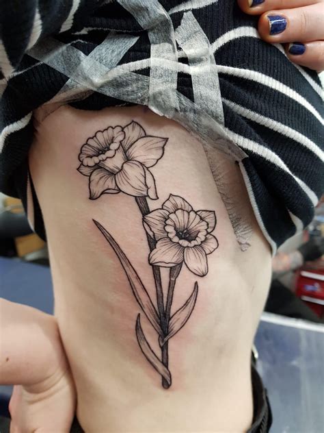 • gothic, • biker • celtic tattoos. First tattoo! My twin and I got matching daffodil tattoos ...