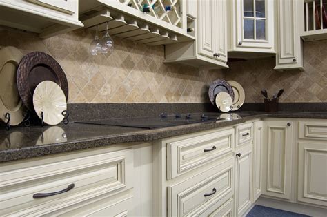 Unlike many granites, you can find it in slabs over 8' x 8'. Heritage White cabinets with Quartz counter top and Travertine backsplash. # ...