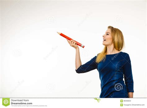 There are lots of tips and techniques for you to learn from these authors. Positive Woman Holds Big Pencil In Hand Stock Photo ...