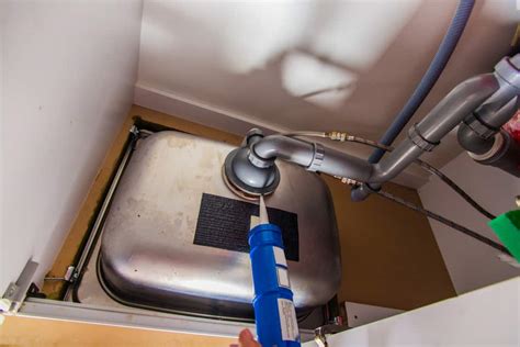 It's dark and wet and full of food residue. Why Is My Kitchen Sink Leaking Around The Edges? | Mr ...