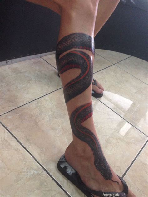 However, the tattoo with a snake looks interesting on the arm or leg. leg black Snake red belly tattoo done by Agung Dana Goerat ...