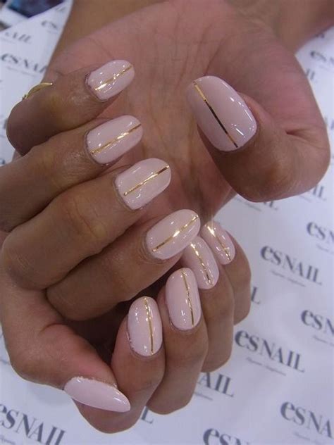 Nails with one gold strip on pink background----repinned ... Hot red nail designs with accent nails.